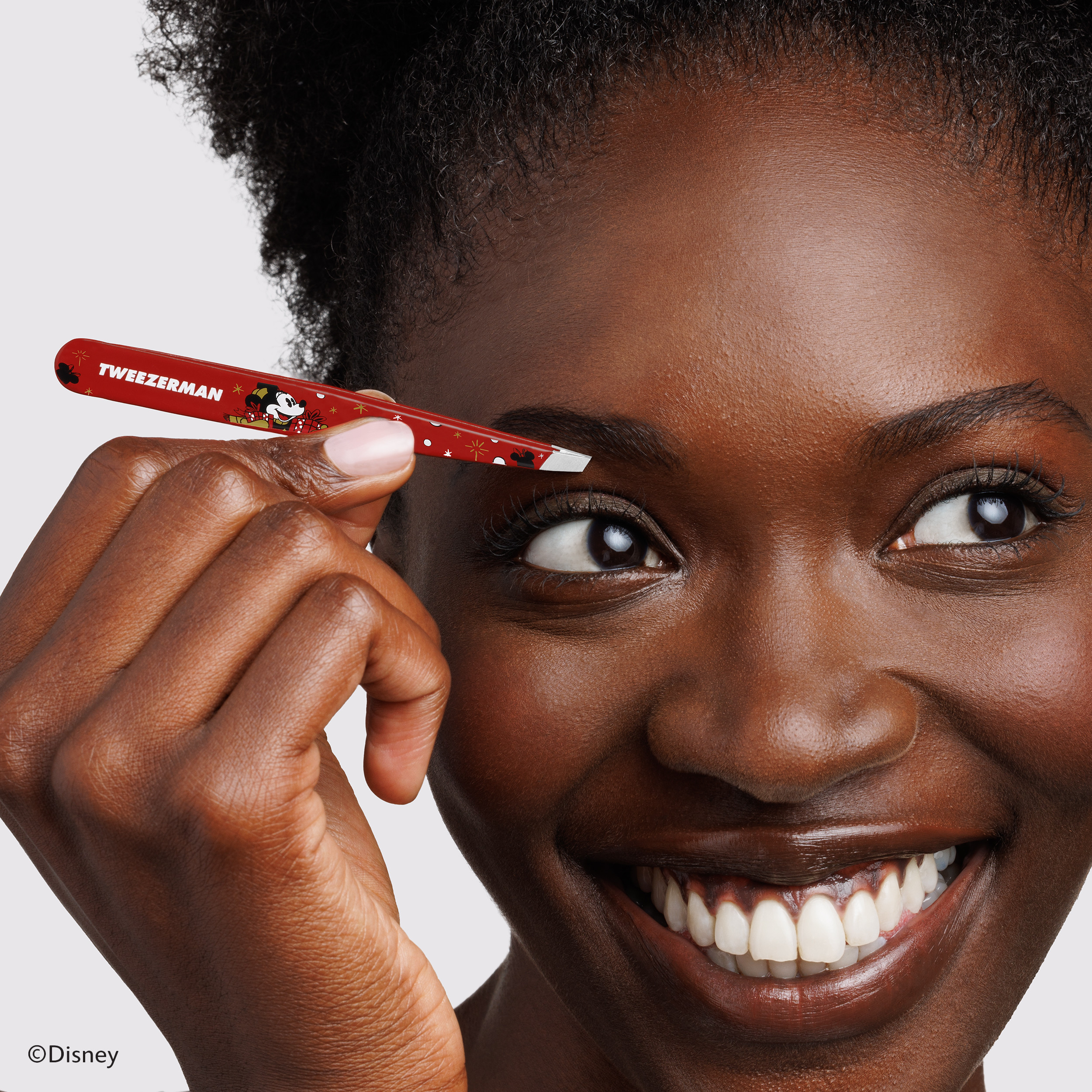 Model using Disney's Mickey Mouse & Minnie Mouse Magic all Around Slant Tweezer