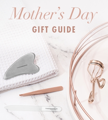 Tweezerman | Mother's Day Gift Guide. Stainless steel gua sha, rose gold slant tweezer, glass nail file, rose gold classic lash curler, procurl lash curler