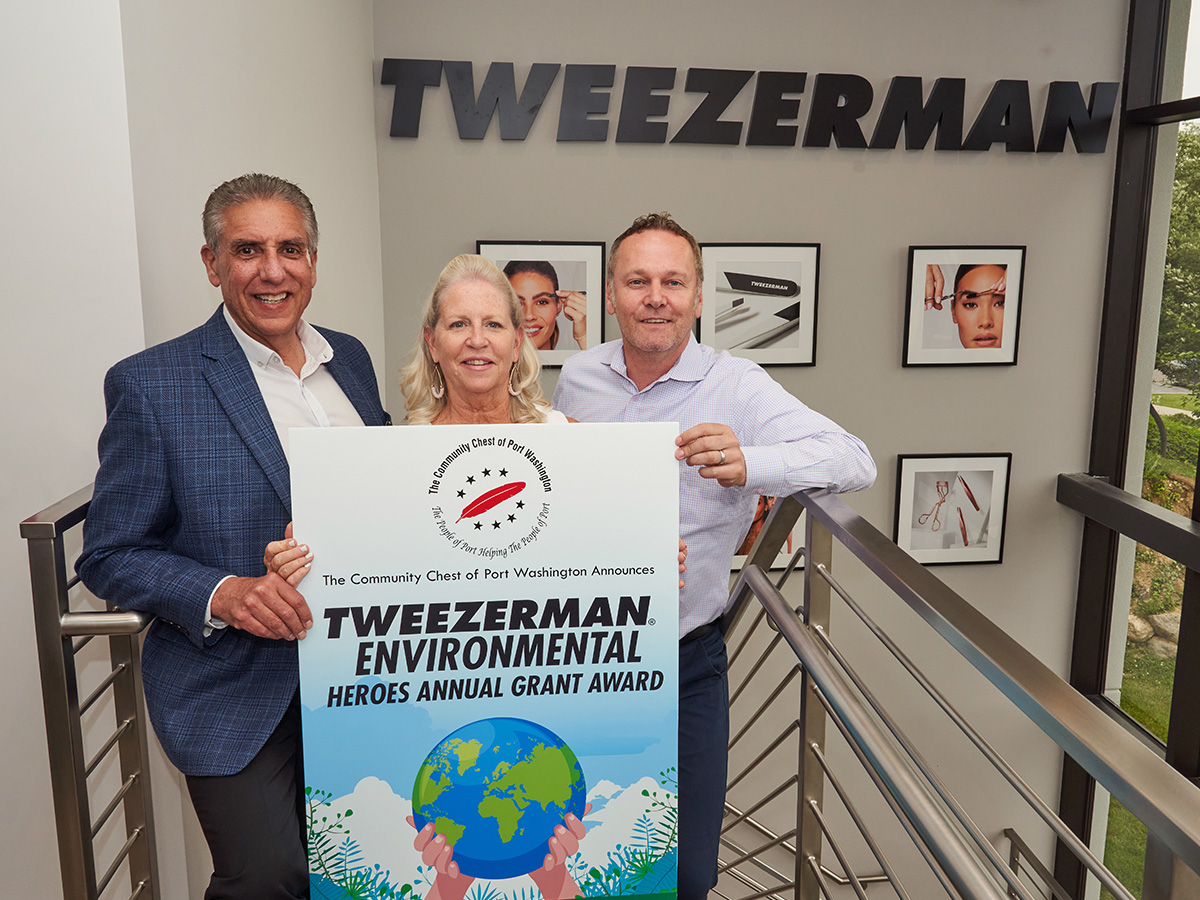 Tweezerman employees holding Tweezerman Environmental Heroes Annual Grant Award